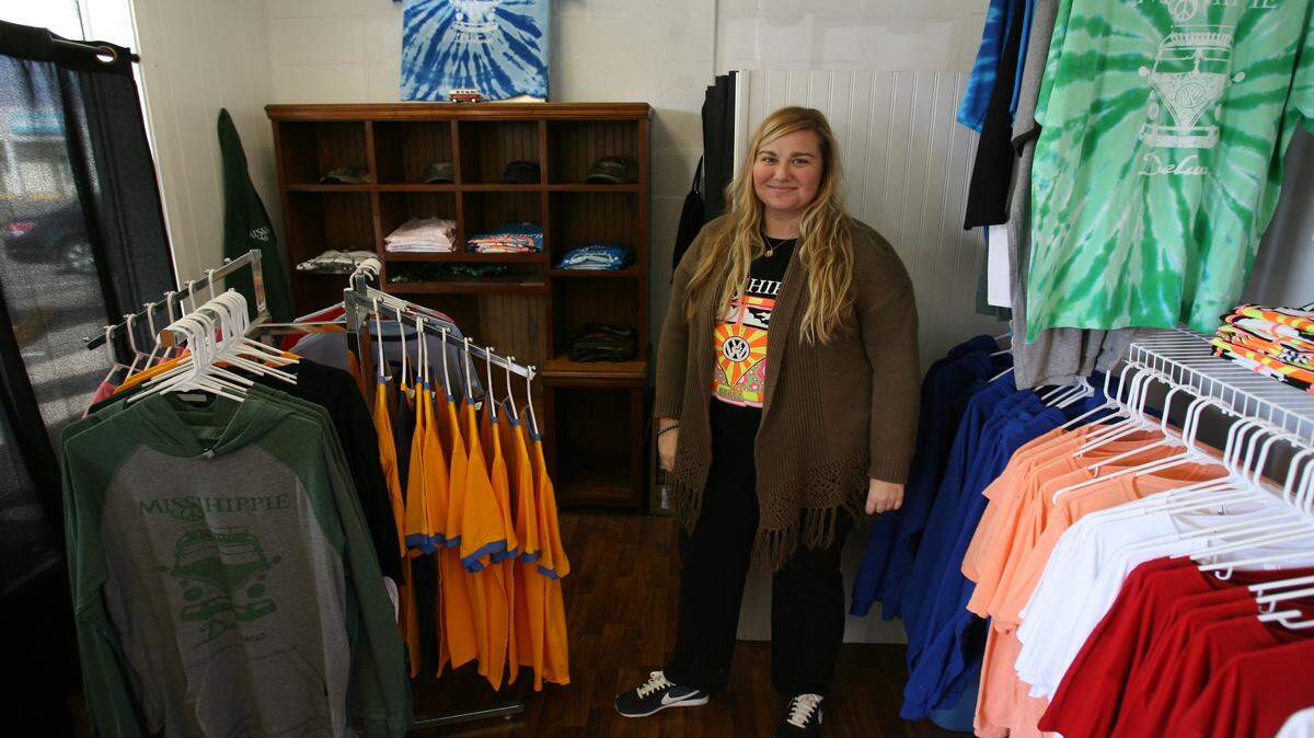 JUSTIN MITCHELL/SUN HERALDMaggie Banks, owner of the MissiHippie clothing line, gives some of her proceeds to Bright Kids, an orphanage in Uganda. She sells her shirts at Matthew Print and Apparel in Gulfport.