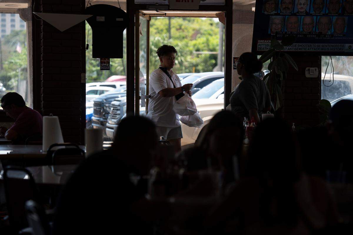 Guests carry out Vietnamese dishes at Kim Long in Biloxi on Wednesday, Aug. 2, 2023.