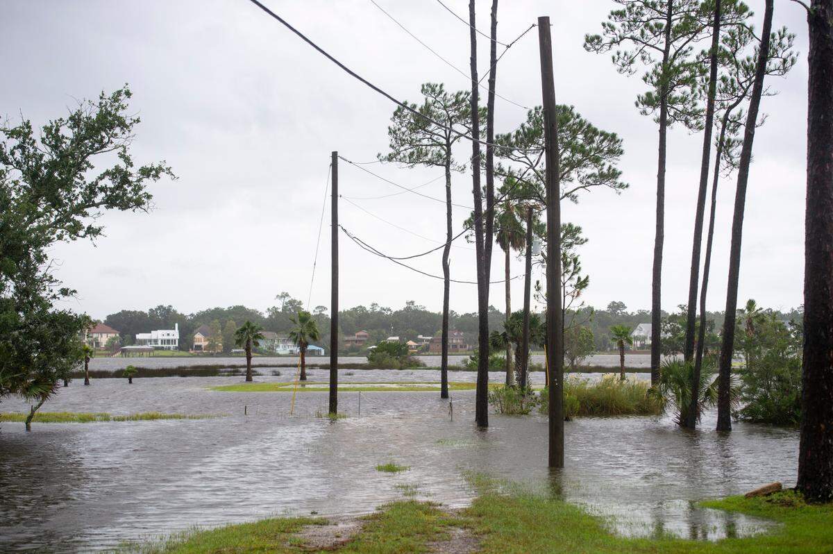 Flooding off of Back Bay on Shore Drive in Gulf Hills the morning after Hurricane Ida on Monday, Aug. 30, 2021.
