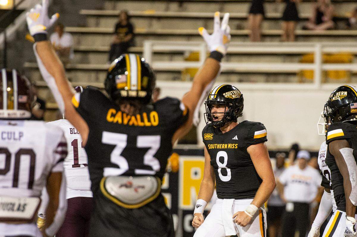 Southern Miss Golden Eagles quarterback Billy Wiles (8) celebrates after scoring a touchdown during a game against Texas State at M.M. Roberts Stadium in Hattiesburg on Saturday, Sept. 30, 2023.