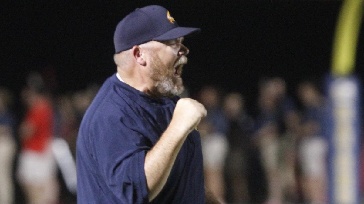 Gautier head coach Marc High cheers after the Gators took a 17-0 lead over Hancock  during the second quarter of their game at Vaughn-Wallace Stadium in Gautier on Friday, Aug. 31, 2018.