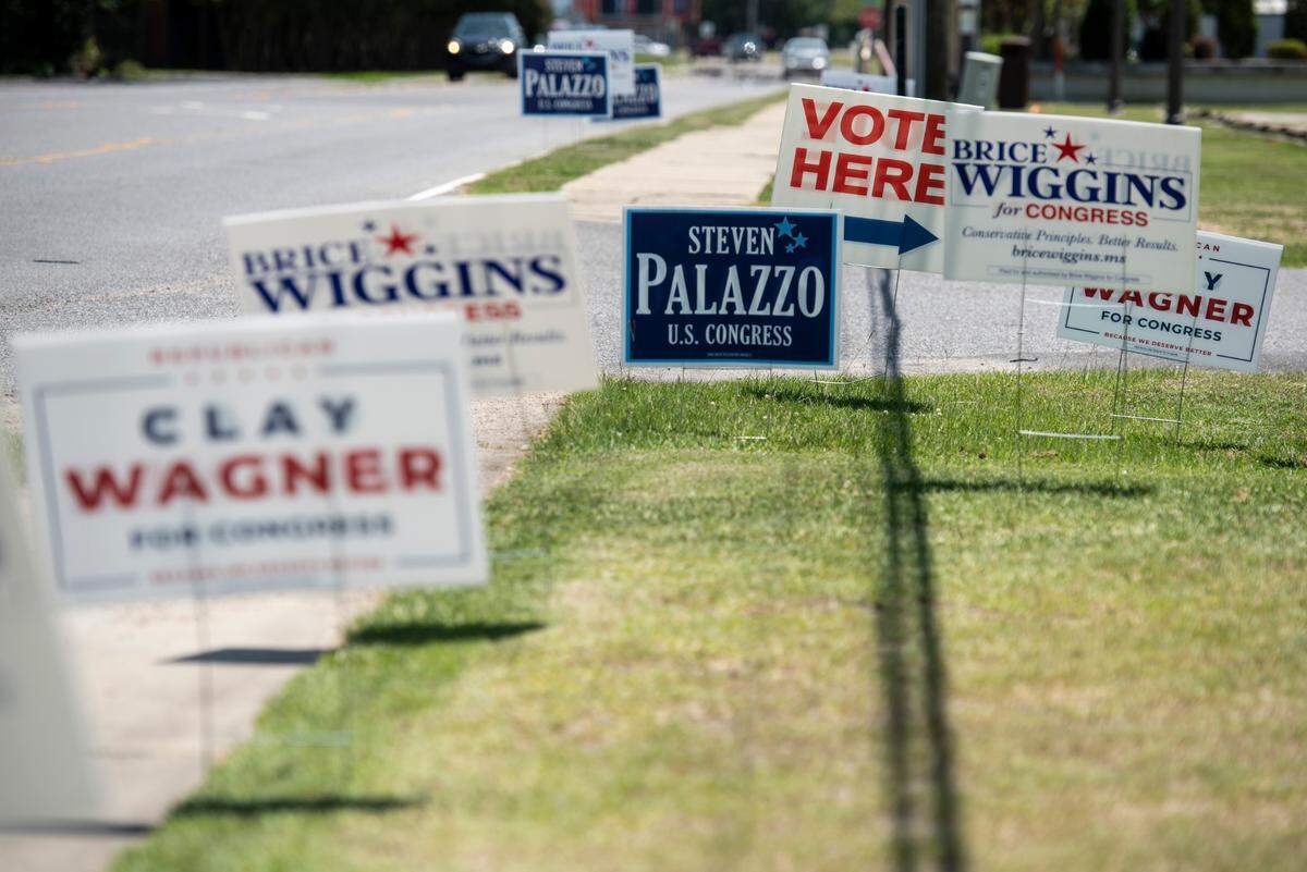 Signs for different Congressional candidates sit outside the D’Iberville Civic Center on Tuesday, June 7, 2022.
