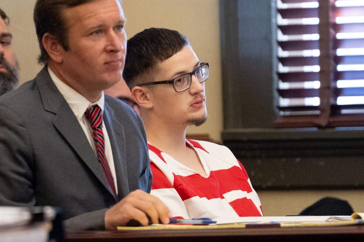 Cameron Brand, charged with two counts of murder and four counts of aggravated assault, sits in court with his attorney, Lee Russell, during a motion hearing at Hancock County Circuit Court on Oct. 21, 2025.