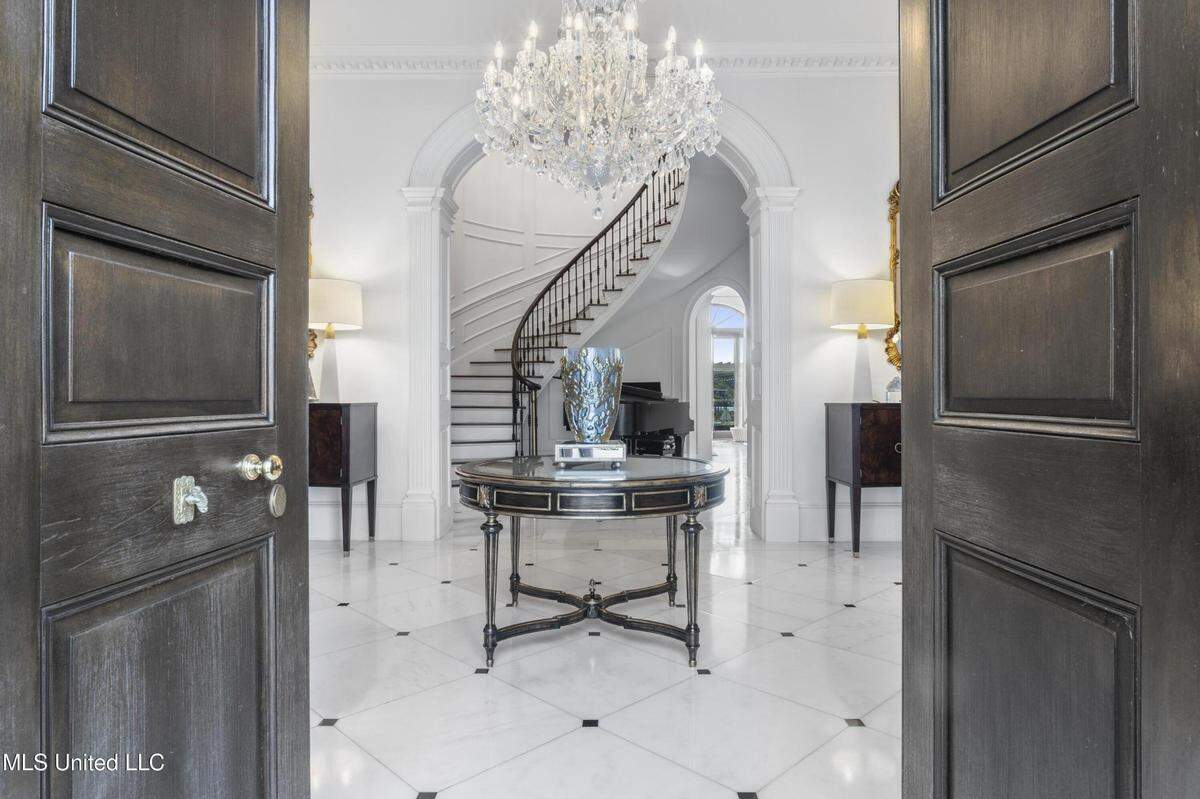 The grand entry hall of this home on the market in Gulfport is pictured with the real estate listing.