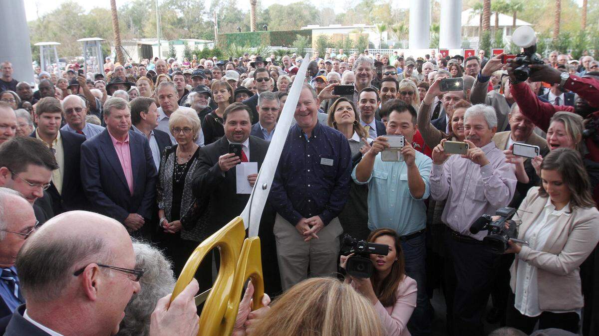 JOHN FITZHUGH/SUN HERALD/FILEScarlet Pearl Casino owner Bob Granieri, bottom left, prepares to cut the ribbon on his casino in D'Iberville in December. Taxes from the first month's winnings at the casino provided $270,000 in revenue to the city, area schools and police and fire departments.