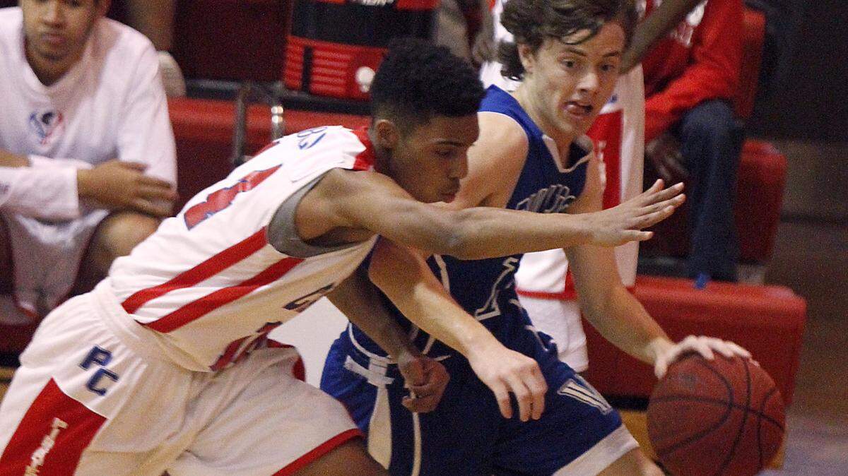 TIM ISBELL/SUN HERALD 
 Vancleave guard Trevor Davis drives the baseline against Pass Christian's Raymond Obillo, Thursday, Feb. 18, 2016.