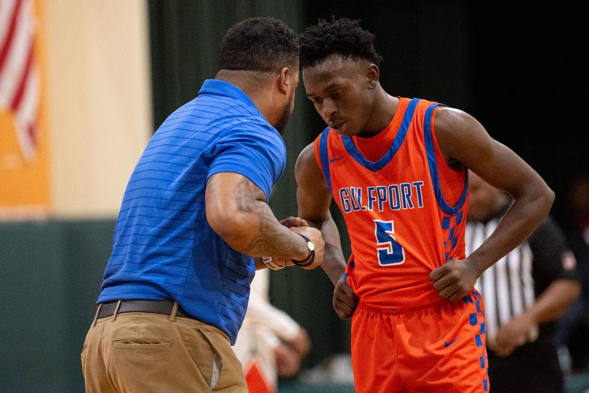 Gulfport's Travor Frost (10) speaks Tuesday with Gulfport head coach Brian Butler.