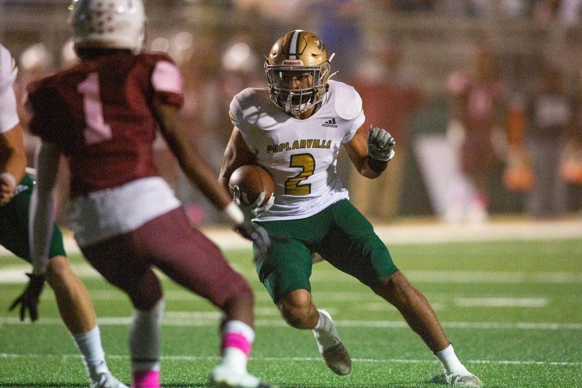 Poplarville runningback Maurice Travis runs the ball down the field during a game against Lawrence County at Poplarville High School in Poplarville on Friday, Oct. 7, 2022.