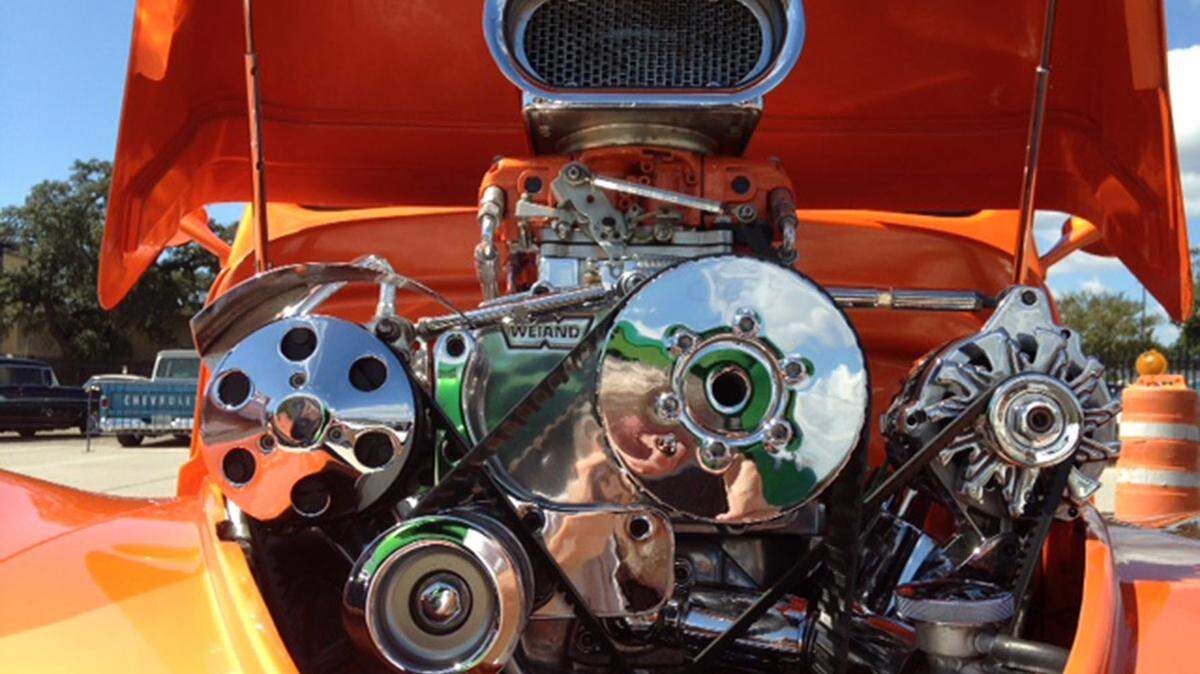 LAWRENCE WHEELER/SPECIAL TO THE SUN HERALDChrome and horsepower burst out of the hood of this 1941 Willys, which is powered by a blown big-block Chevy engine, at Cruising' The Coast's Salute to Our Veterans at MGM Park in Biloxi on Tuesday.
