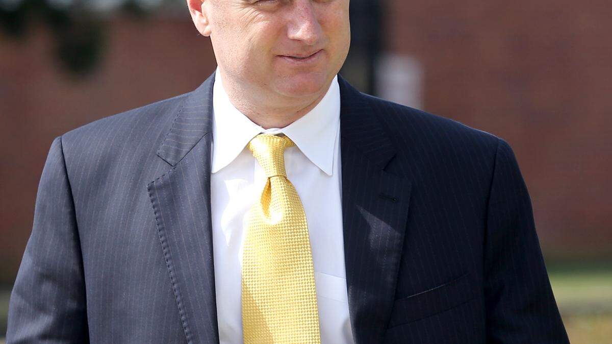 AMANDA McCOY/SUN HERALD 
 Contractor S.H. 'Sean' Anthony, charged with conspiracy in the bribery of the former Harrison County Utility Authority director and a board member, right, arrives at the federal courthouse in Gulfport for his initial hearing on Tuesday, March 3, 2015. At his initial hearing before Magistrate Judge Robert H. Walker, Anthony entered a plea of not guilty. However, his attorney Joe Sam Owen, said Anthony plans to enter a guilty plea before a district judge at a later date.