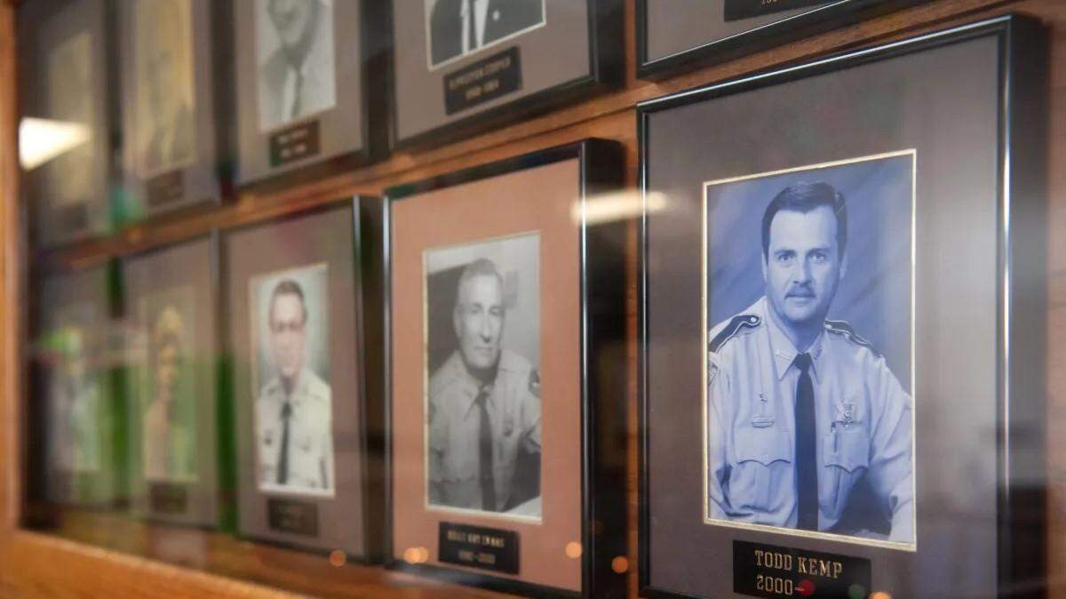 A photo of Clarke County Sheriff Todd Kemp, right, at the county courthouse in Quitman.