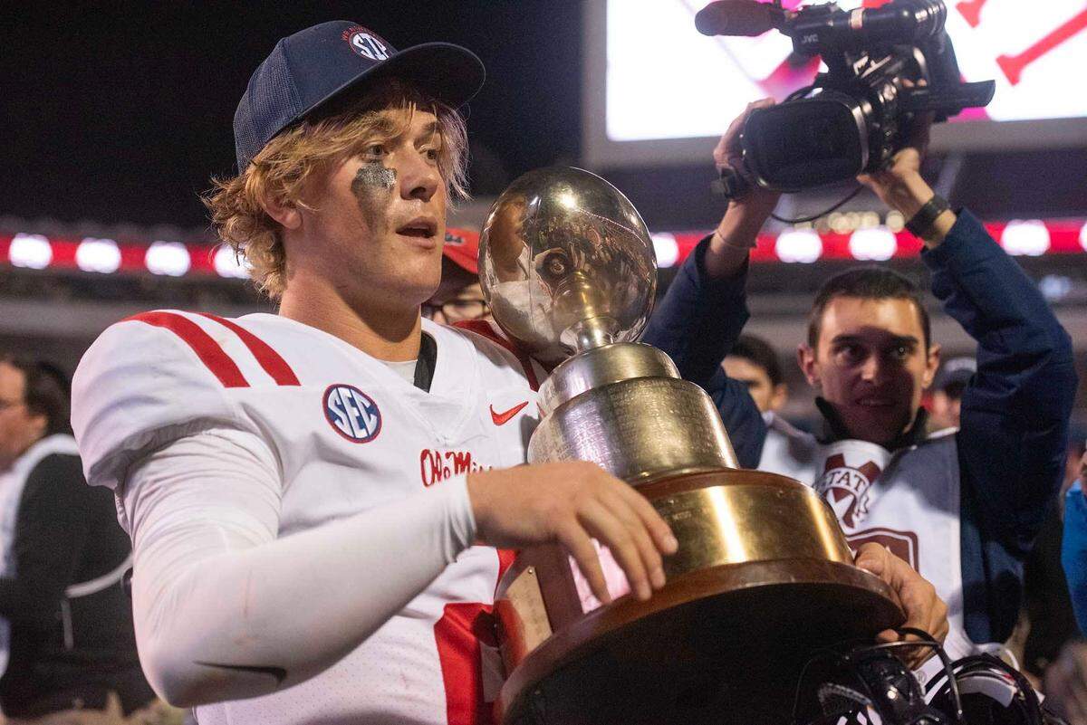 Quarterback Jaxson Dart celebrates Ole Miss' Egg Bowl win over Mississippi State at Davis Wade Stadium in Starkville, Miss., Thursday, Nov. 23, 2023.