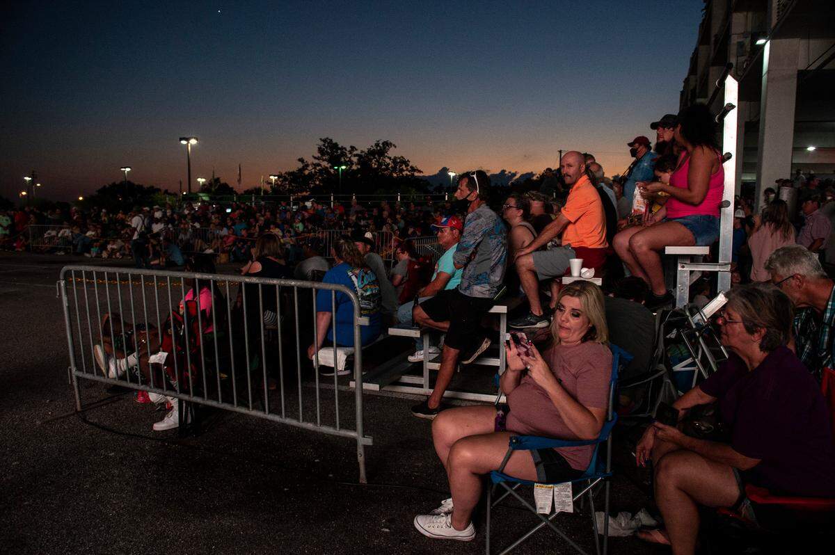 Crowds gather to watch the flame throwing competition, where drivers compete to see which car can produce the biggest flames, at Island View Casino in Gulfport during Cruisin’ The Coast on Tuesday, Oct. 5, 2021.