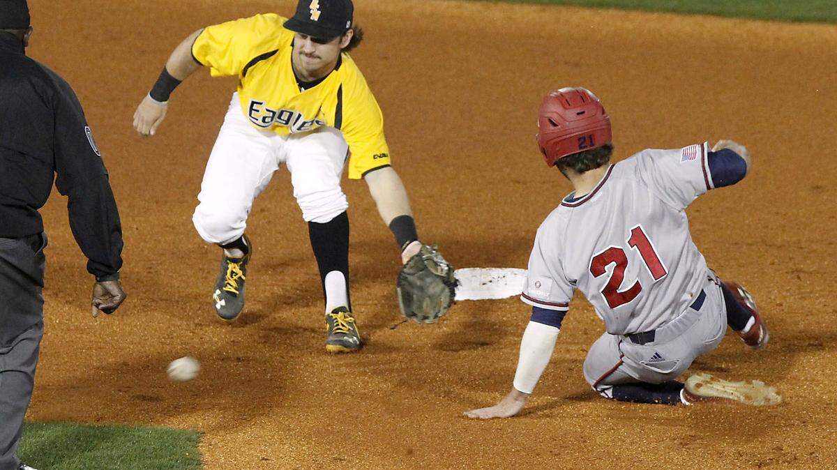 TIM ISBELL/SUN HERALD 
 Southern Miss shortstop Nick Dawson reaches for the ball as South Alabama's Travis Swaggerty steals second on March 2 at MGM Park in Hattiesburg. USM takes on Tulane at 7 p.m. Tuesday at MGM Park.