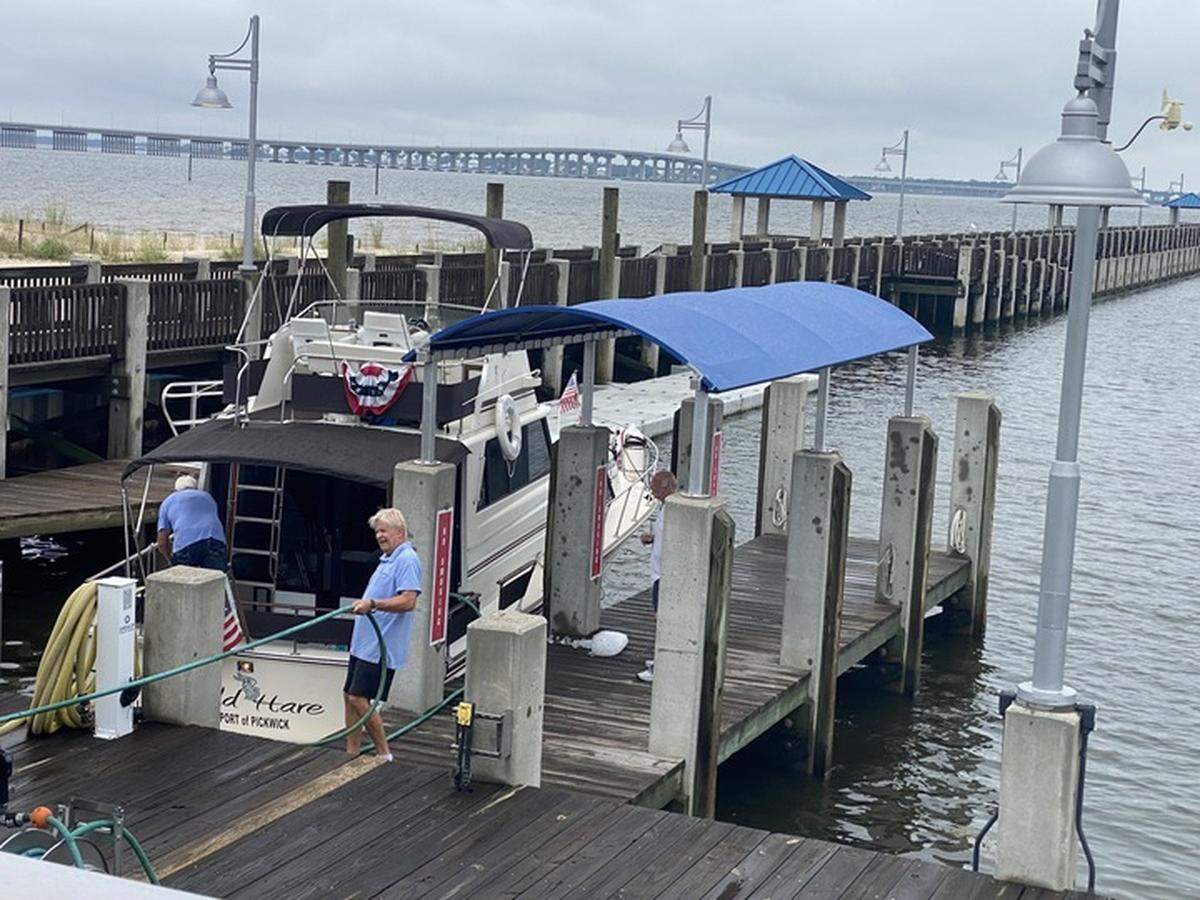 Owners scramble to get their boats out of the water Tuesday after the city issued a mandatory evacuation of the harbor as Tropical Storm Francine nears.