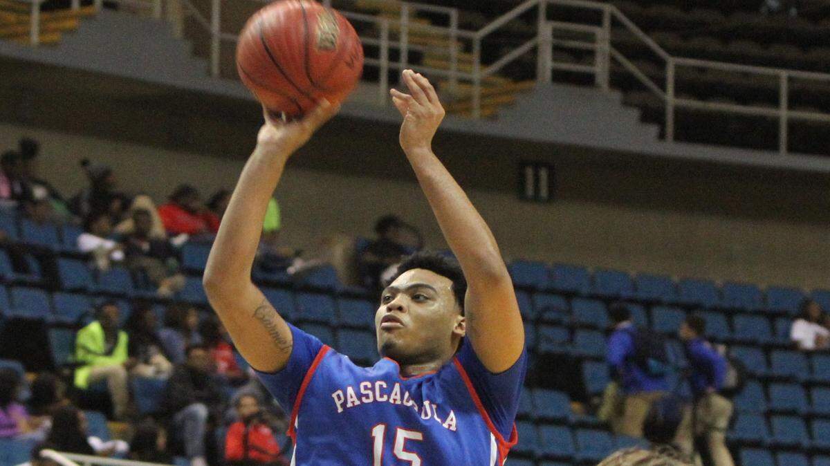 JOHN FITZHUGH/SUN HERALD 
 Pascagoula's Jacques Belford puts up a shot against D'Iberville during the second quarter of their Hoopsfest game at the Mississippi Coast Coliseum in Biloxi on Saturday Jan. 30, 2016.