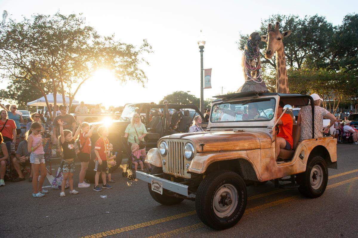 Cruisers drive down Jeff Davis Avenue during the Long Beach Parade in Long Beach, one of the events in Cruisin’ The Coast, on Monday, Oct. 7, 2024.