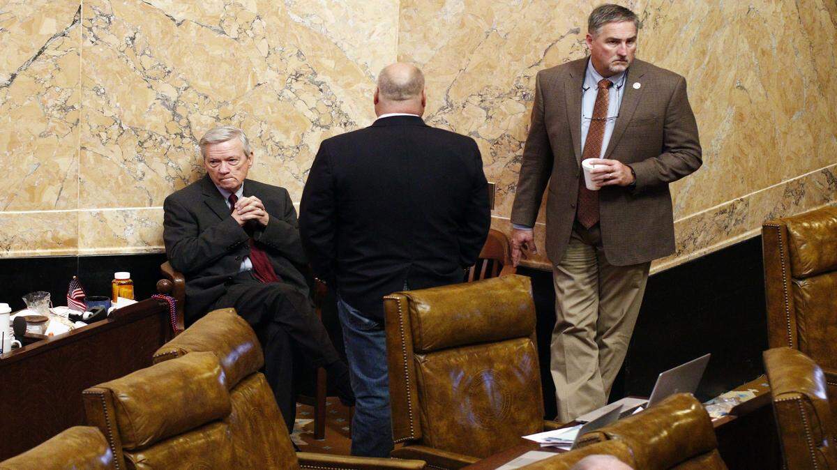 ROGELIO V. SOLIS/ASSOCIATED PRESS 
 Republican Reps. Mac Huddleston of Pontotoc, left, Donnie Bell of Fulton, center and Vince Mangold of Brookhaven, wait for the House to end the long Friday morning recess at the Capitol in Jackson. Instead, they broke for lunch to return that afternoon. The House had an extraordinarily contentious Thursday, and it was unclear how much they would accomplish Friday as they were in recess much of the morning.