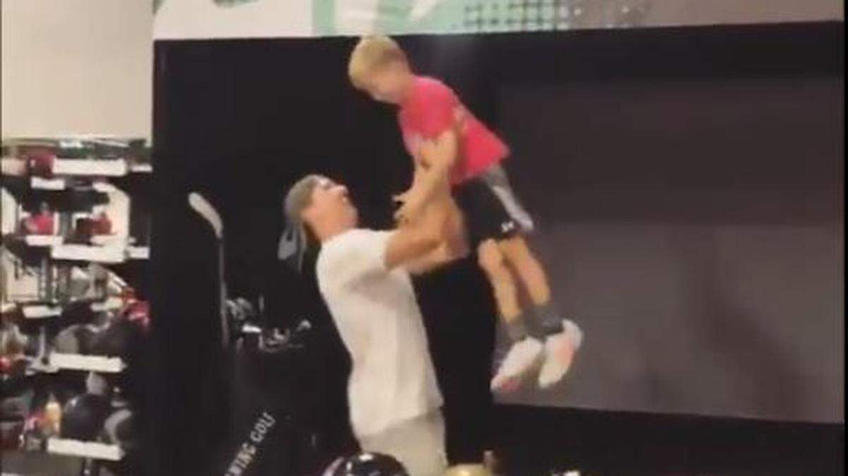 Drew Brees celebrates with son Bowen after his eldest made a trick shot with a little help from Dad.
