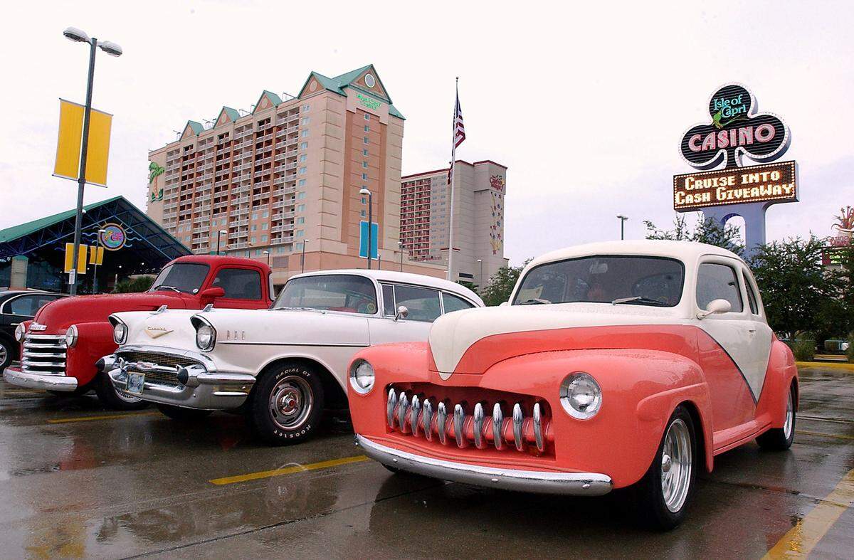 A 1947 Ford Coupe, right, A Chevy BeAir, center, and a 1949 Chevy Pickup truck were just several of many Cruisin The Coast classic cars parked outside of the Isle of Capri Casino in Biloxi.