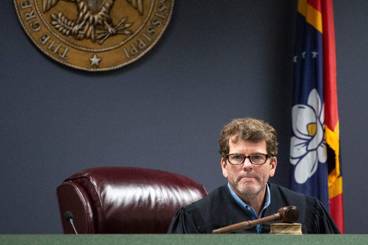 Jackson County Circuit Court Judge Calvin Taylor listens to a prosecutor as he presides over James Hawkins’ initial appearance in Jackson County Circuit Court in Pascagoula on Friday, Dec. 1, 2023. Hawkins, a former Ocean Springs physics teacher, was denied bond after being charged with one count of sexual battery for allegedly having a sexual relationship with a student.
