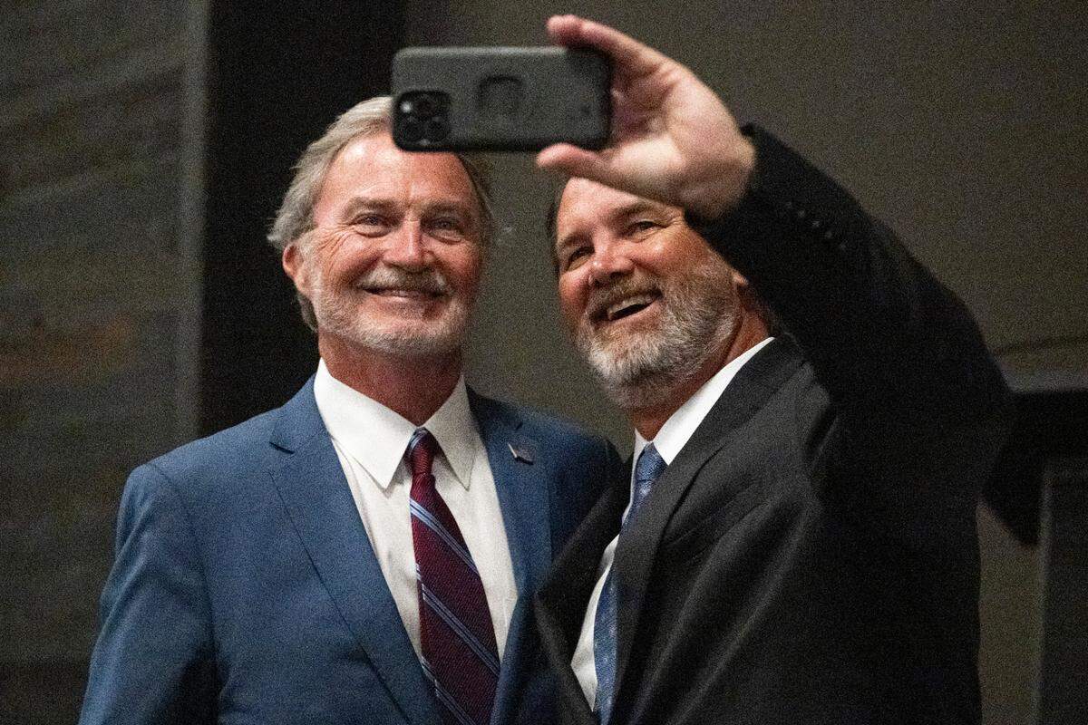 Hugh Keating, left, poses for a selfie at his election party at Centennial Plaza in Gulfport on Tuesday, June 3, 2025. Keating was leading in the mayoral race.