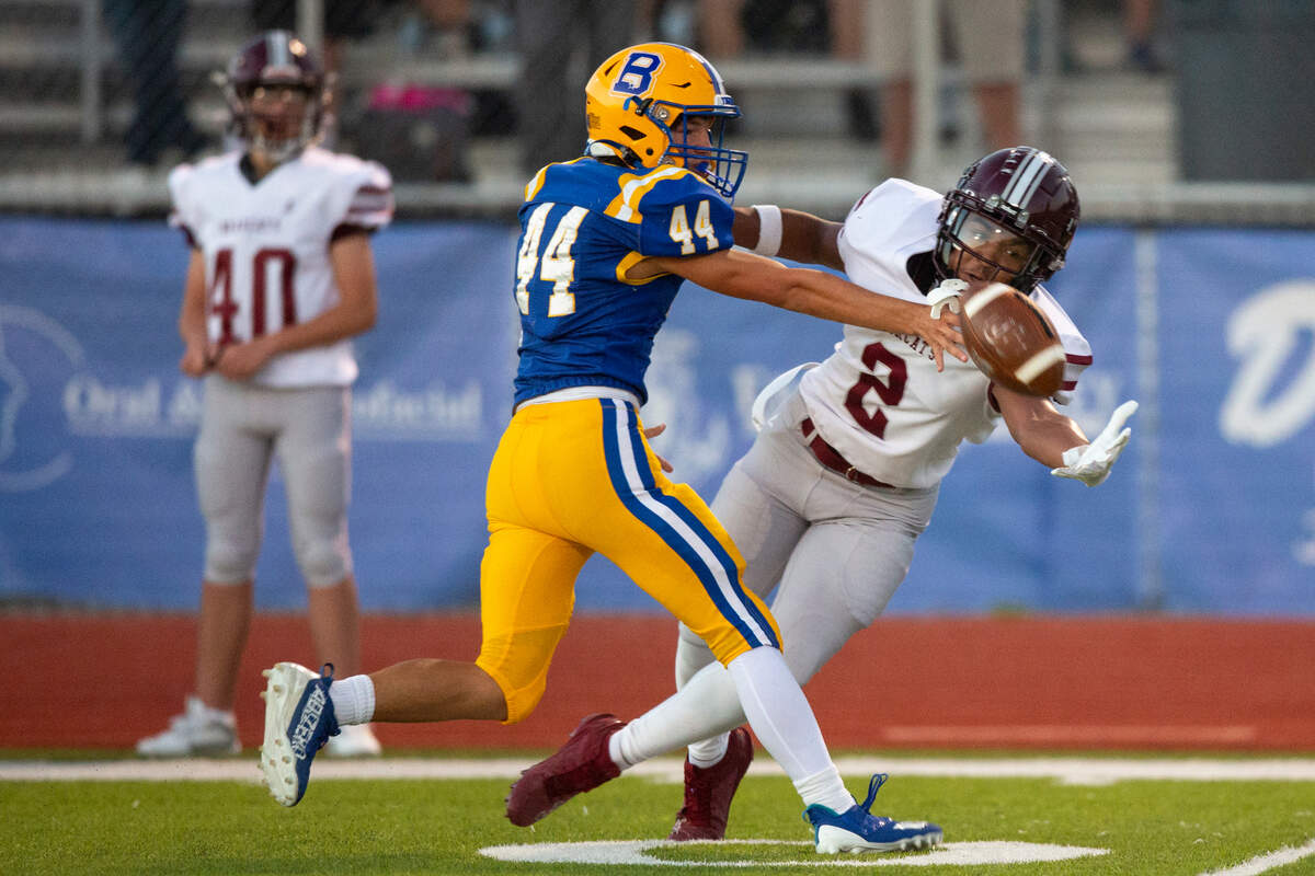 Bay High’s Devin Jones knocks a pass away from Long Beach’s SJ Valentine during a game between Bay High and Long Beach at Tiger Stadium in Bay St. Louis on Friday, Sept. 13, 2024.