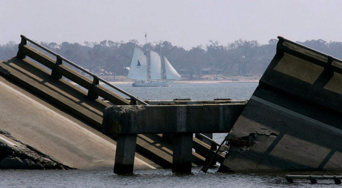 The Biloxi Schooner Glenn L. Swetman sails past the destroyed Biloxi Bay bridge on Sept. 16, 2005. The appearance of the ship after Hurricane Katrina gave many hope during the aftermath of the storm.