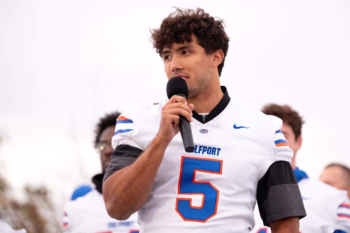 Gulfport running back Cooper Crosby gives a speech during the Champions Christmas Parade in Gulfport on Monday, Dec. 8, 2025.
