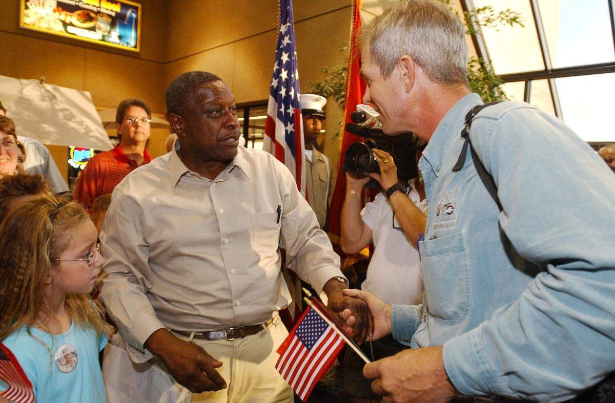 The Sun Herald reporter Patrick Peterson is greeted Monday at the Gulfport-Biloxi International Airport by an unidentified relative of a soldier fighting in Iraq.