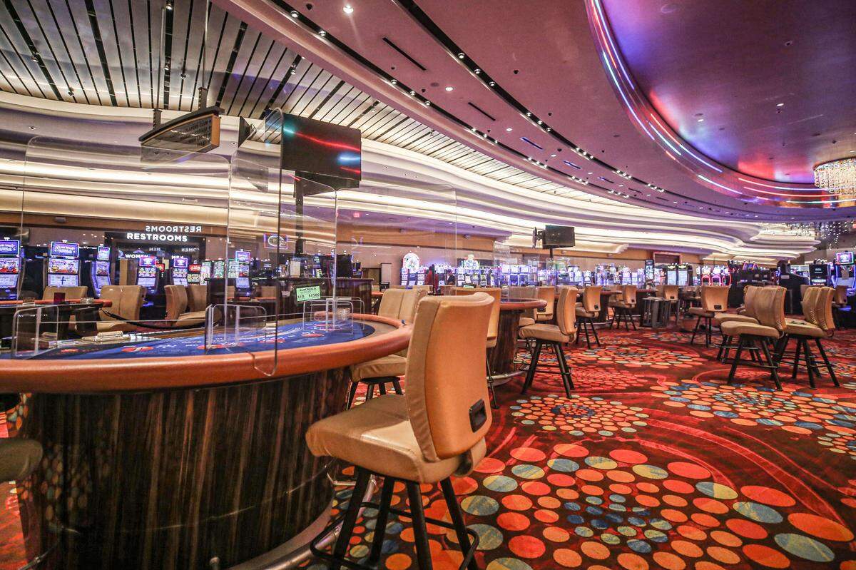 Scarlet Pearl Casino in D’Iberville installed plastic barriers at some of the tables games and slot machines as added safety measures to protect against the spread of COVID-19, as shown in this May 2020 file photo. The casino management this summer required all staff members be fully vaccinated.