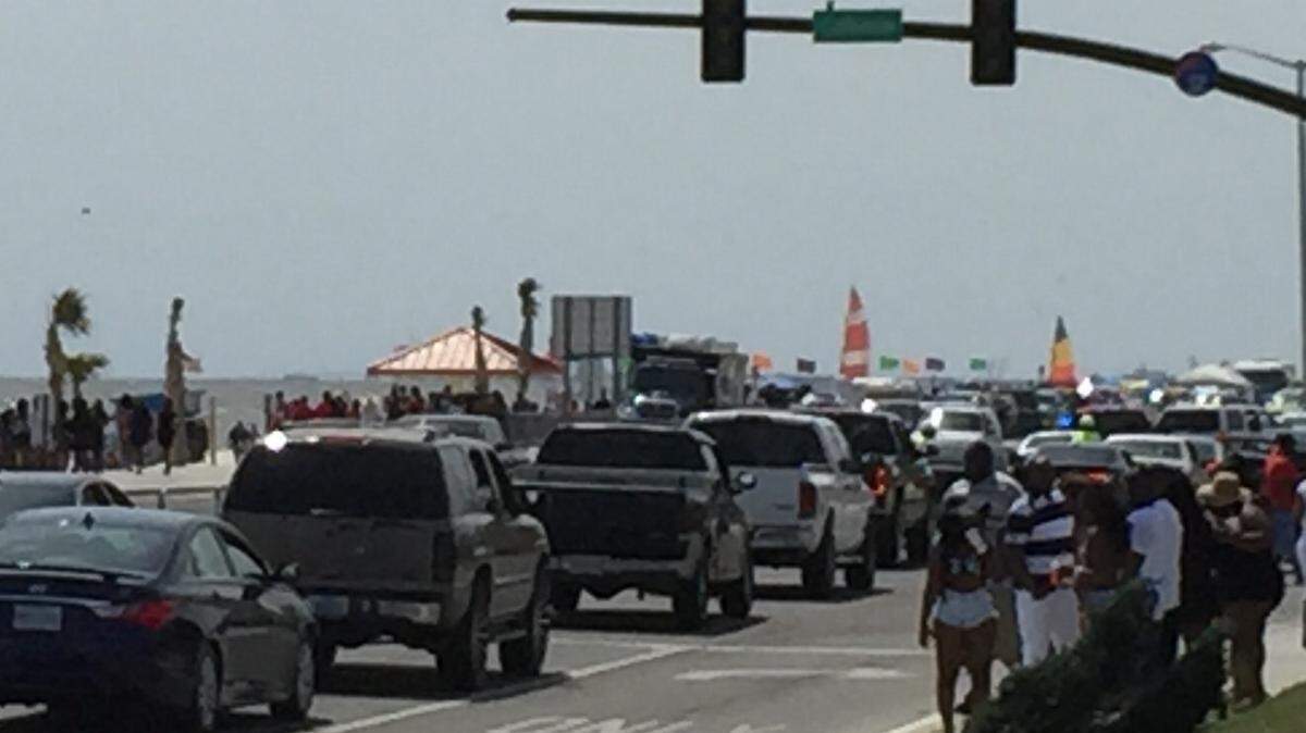 JEFF CLARK/SUN HERALDBiloxi Black Beach Weekend visitors line the beach as traffic started to get heavy on U.S. 90 near the Mississippi Coast Coliseum on Saturday, April 9, 2016.