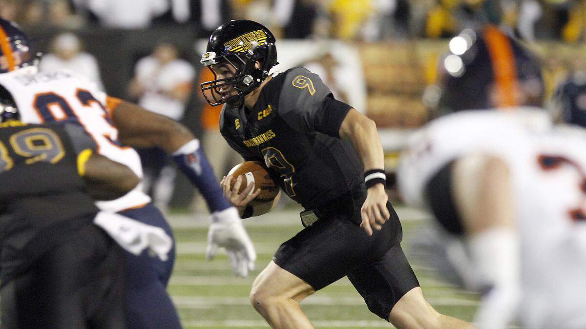 TIM ISBELL/SUN HERALD 
 Southern Miss quarterback Nick Mullens scrambles for a first down against UTSA on Oct. 17 in Hattiesburg.