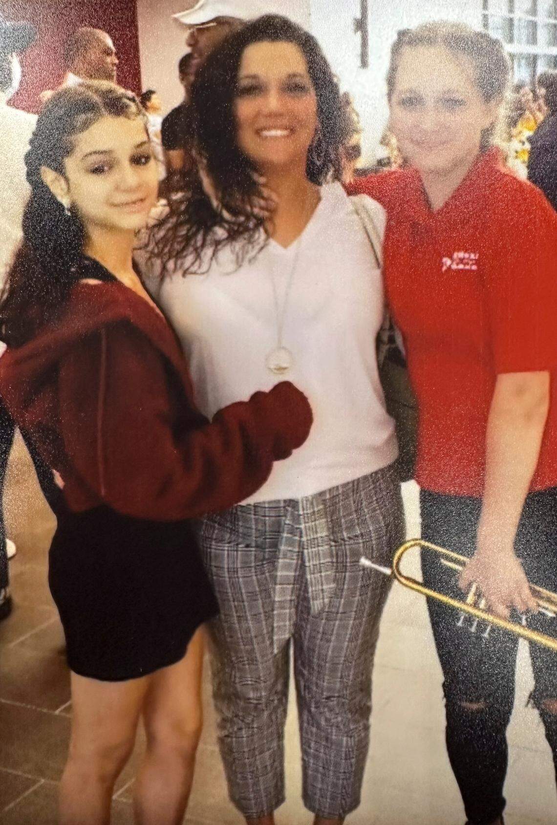 Kayelyn Drake, left, her mother Viola Carter, center, and her sister.