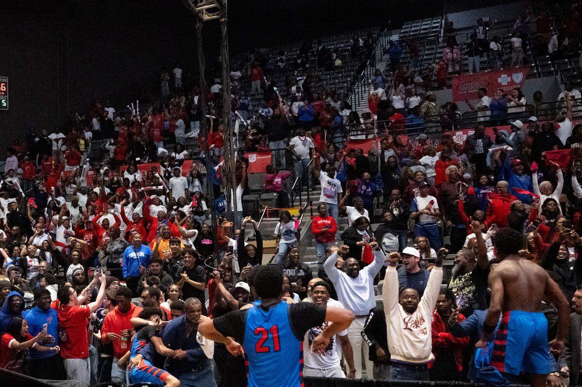 Pascagoula's Tamir Boykin (21) runs to the stands to celebrate after the Panthers captured the MHSAA boys basketball 6A state championship.