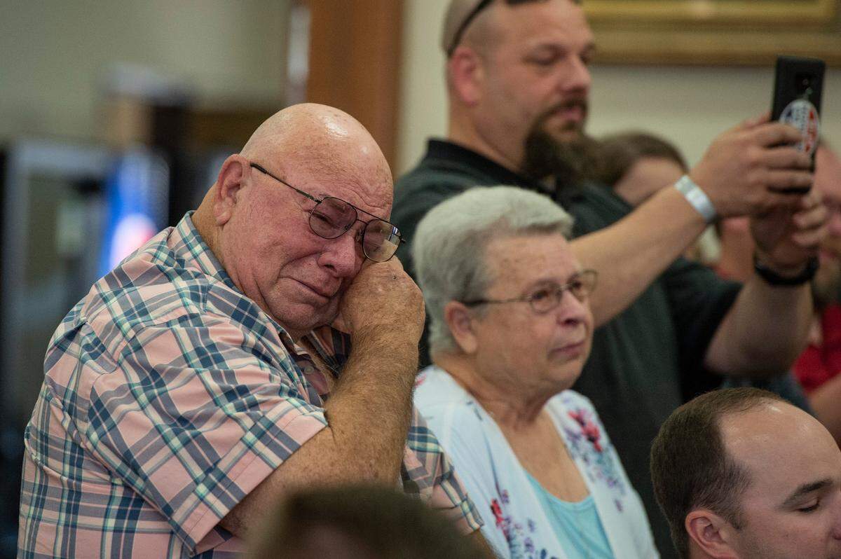 Clifton Busby wipes away tears as the adoption of his now legal grandchildren, Micheal and Colton becomes final during adoption day in Pascagoula on Thursday, March 10, 2022.