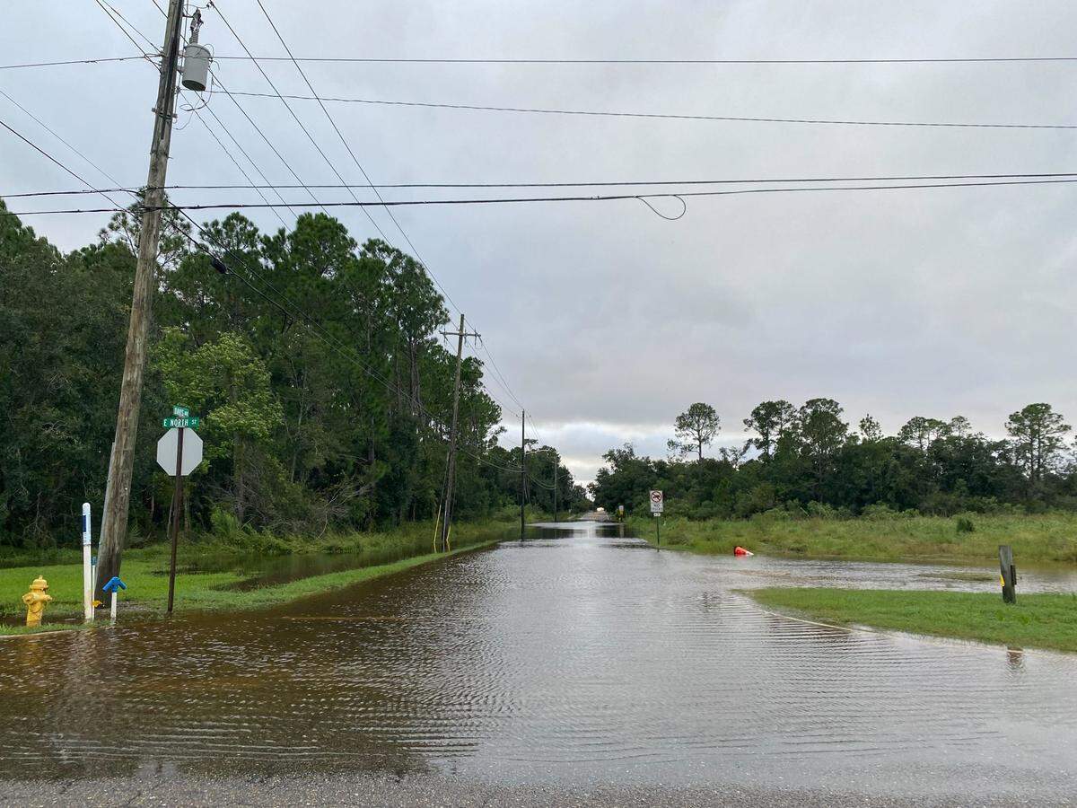 The intersection of E North Street and Davis Avenue is flooded in Pass Christian.