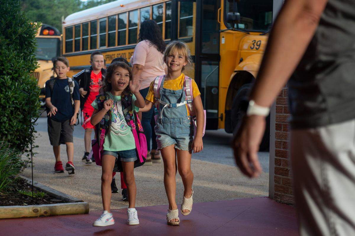 Elementary school kids greet their teachers and staff as they return to Magnolia Park Elementary in Ocean Springs for the first day of school on Friday, Aug. 5, 2022.