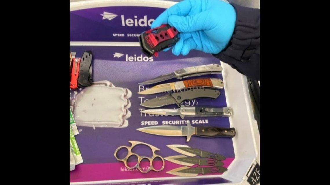 Virginia man was cited after agents found 23 weapons in his carry-on bag at Reagan National Airport on May 4, TSA says.