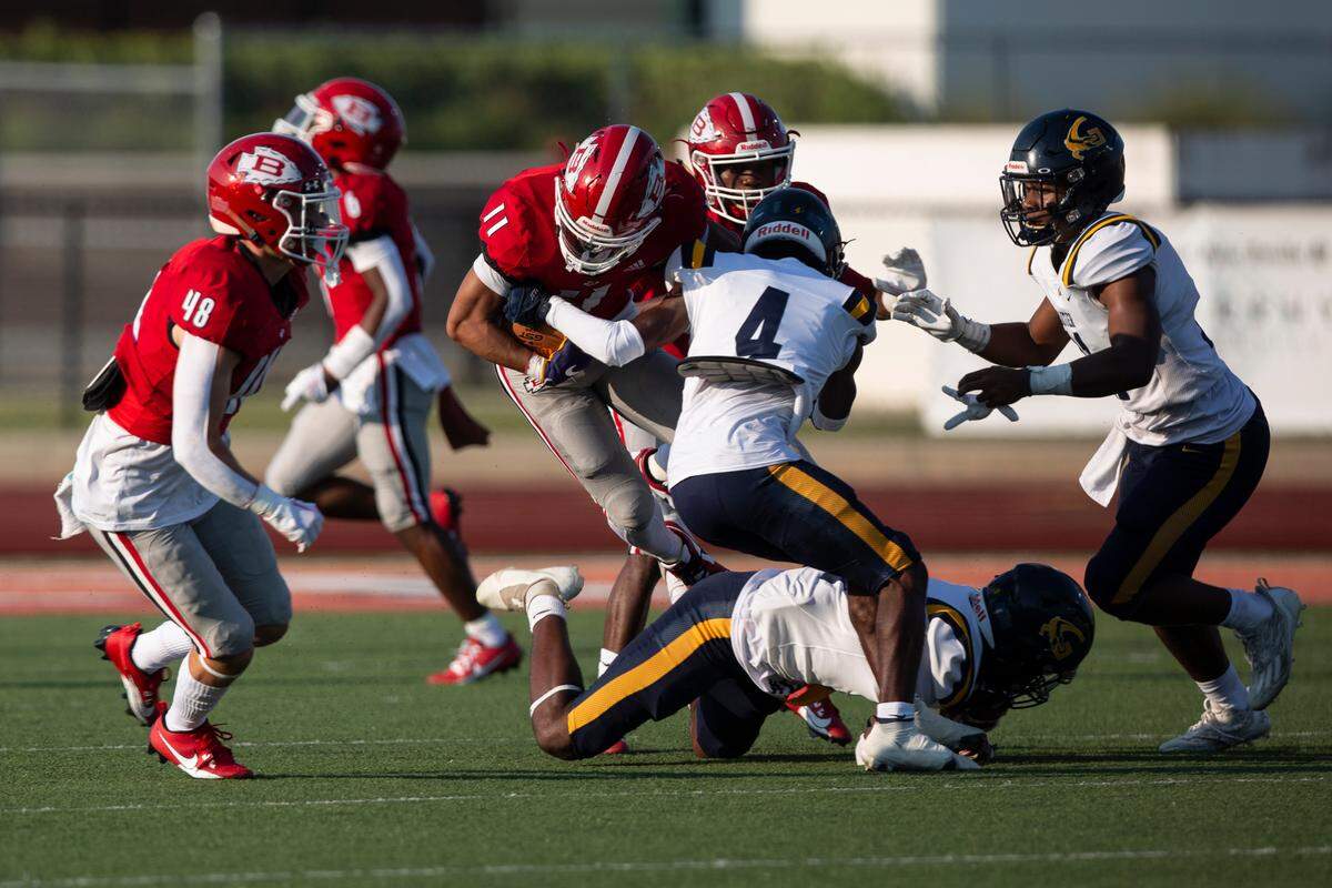Gautier’s Jezreel Pogue (#4) tackles Biloxi’s William Lai (#11) during a Jamboree game at Biloxi High School on Friday, Aug. 18, 2023.