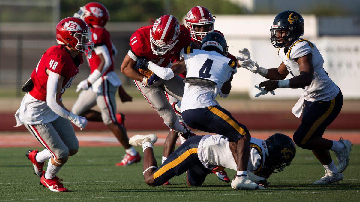 Gautier’s Jezreel Pogue (#4) tackles Biloxi’s William Lai (#11) during a Jamboree game at Biloxi High School on Friday, Aug. 18, 2023.