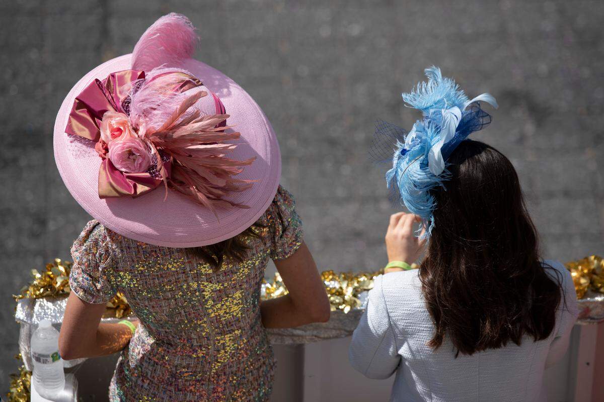 Parade attendees wore fancy hats during the Gulf Coast Carnival Association Mardi Gras Parade in Biloxi on Tuesday, March 1, 2022.