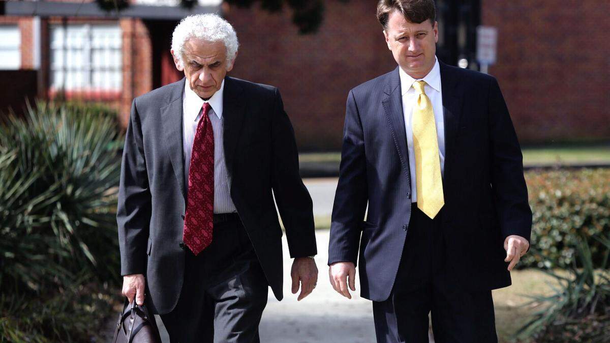 AMANDA McCOY/SUN HERALD 
 Contractor Sean Anthony, right, with his attorney, Joe Sam Owen of Gulfport, pleaded guilty in U.S. District Court in Gulfport to conspiring to bribe two public officials in exchange for work at the Harrison County Utility Authority. He faces up to five years in prison.