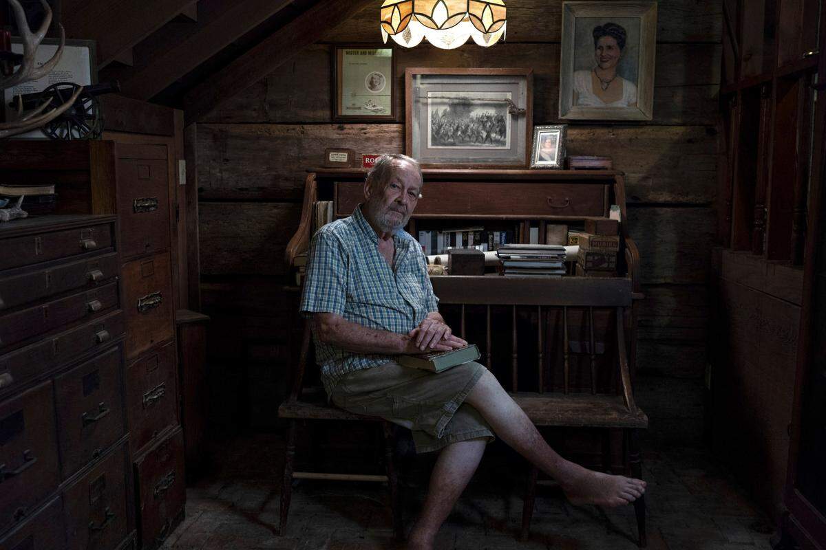 George Cotton, a retired journalist, at home in Vicksburg, Miss., July 18, 2018. However society feels about slavery now, Cotton says, he won’t  let it diminish his admiration for his great-great-grandmother, who owned 30 slaves. “It  may not have been right, but it was the way of life at the time,” he said.