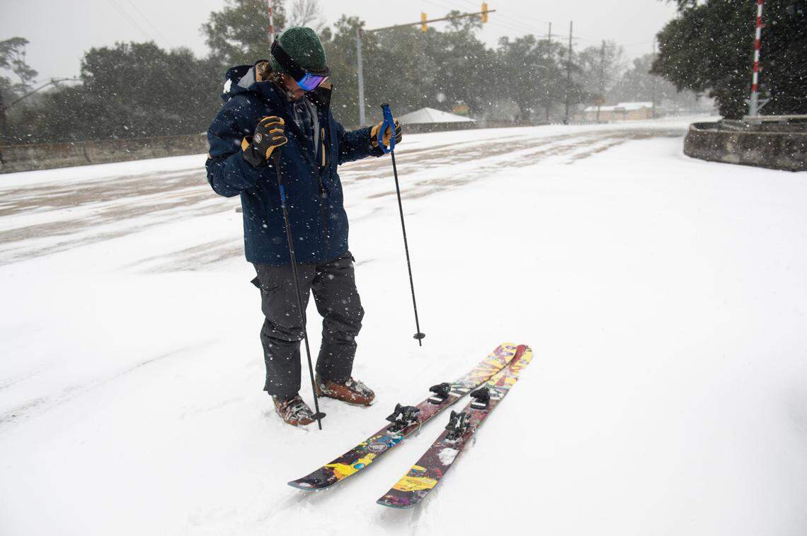 Clint Herring prepares to ski down the Fort Bayou Bridge during a winter storm on the Mississippi Coast on Tuesday, Jan. 21, 2025.