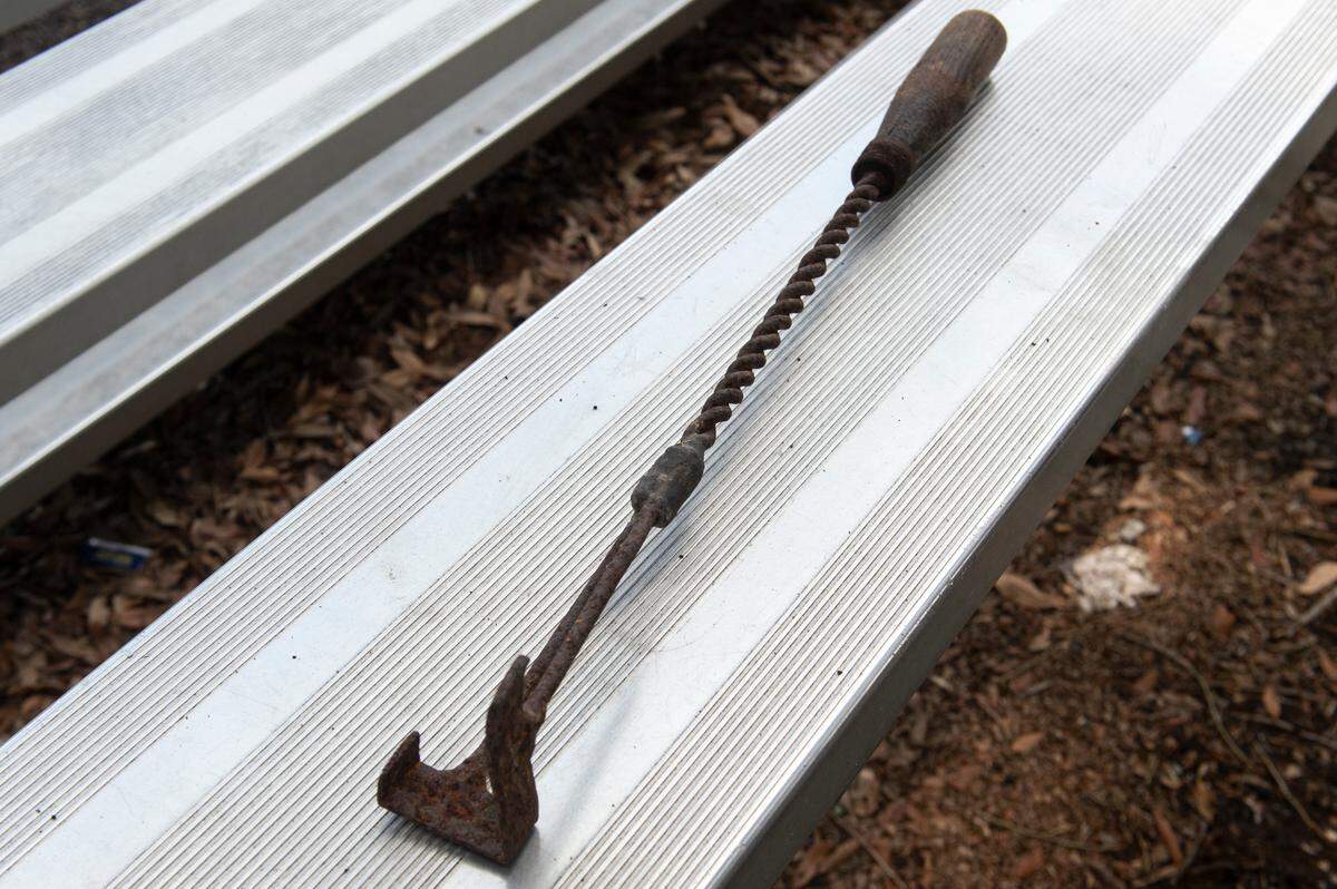 A branding iron used for cattle that belonged to Cushman’s grandfather, John Lee, on Monday, June 24, 2024. John Lee was a cattle rancher on one of the barrier islands.