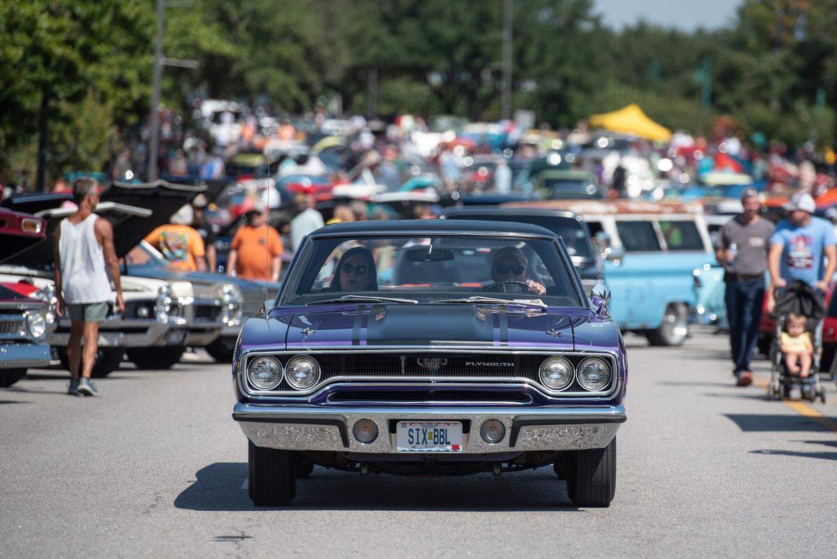 Cruisers drive around downtown Moss Point during Cruisin’ The River City, a Cruisin’ The Coast event in 2024. Drivers and spectators can follow these tips to make it easier to get around.
