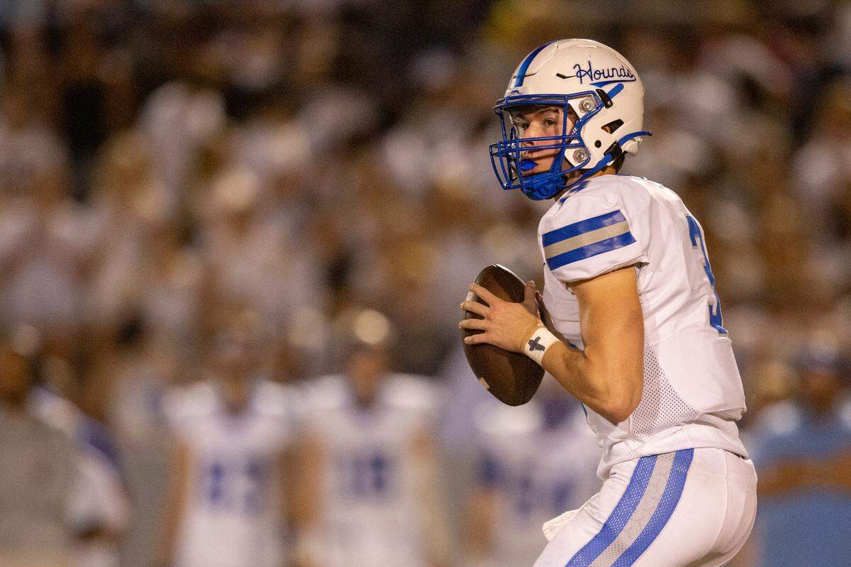 Ocean Springs’ quarterback William Berglind looks for a pass during a game against Gulfport at Milner Stadium in Gulfport on Friday, Oct. 27, 2023. Ocean Springs beat Gulfport 30-7.
