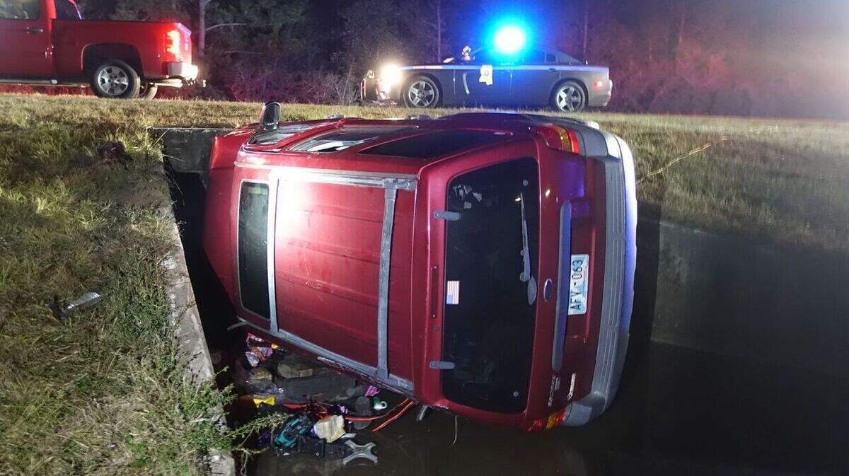 This SUV overturned at the Interstate 10 on-ramp at Exit 20 in Harrison County, trapping the driver in a watery drainage culvert on Saturday, Dec. 1, 2018.