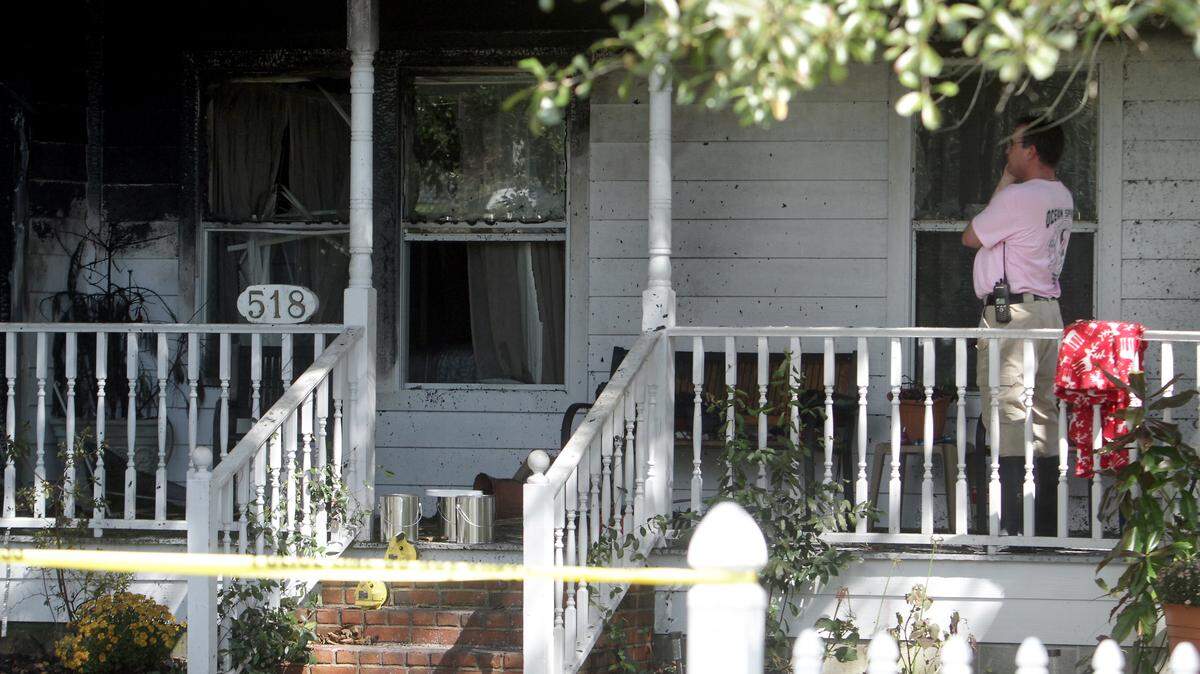 AMANDA McCOY/SUN HERALD 
 Officials investigate the scene where a man fired on officers responding to a domestic disturbance at a home on the 500 block of General Pershing Avenue in Ocean Springs. Timothy Beaugez, 55, is facing two counts of aggravated assault on a police officer and was treated for smoke inhalation at the Ocean Springs Hospital. A Jackson County grand jury indicted Beaugez on Thursday, Jan. 14, 2016.
